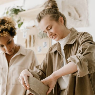 two women holding pots